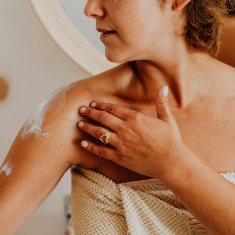 woman applying lotion